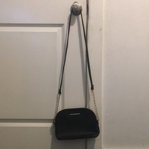 I am selling this unused Steve Madden Black Purse!